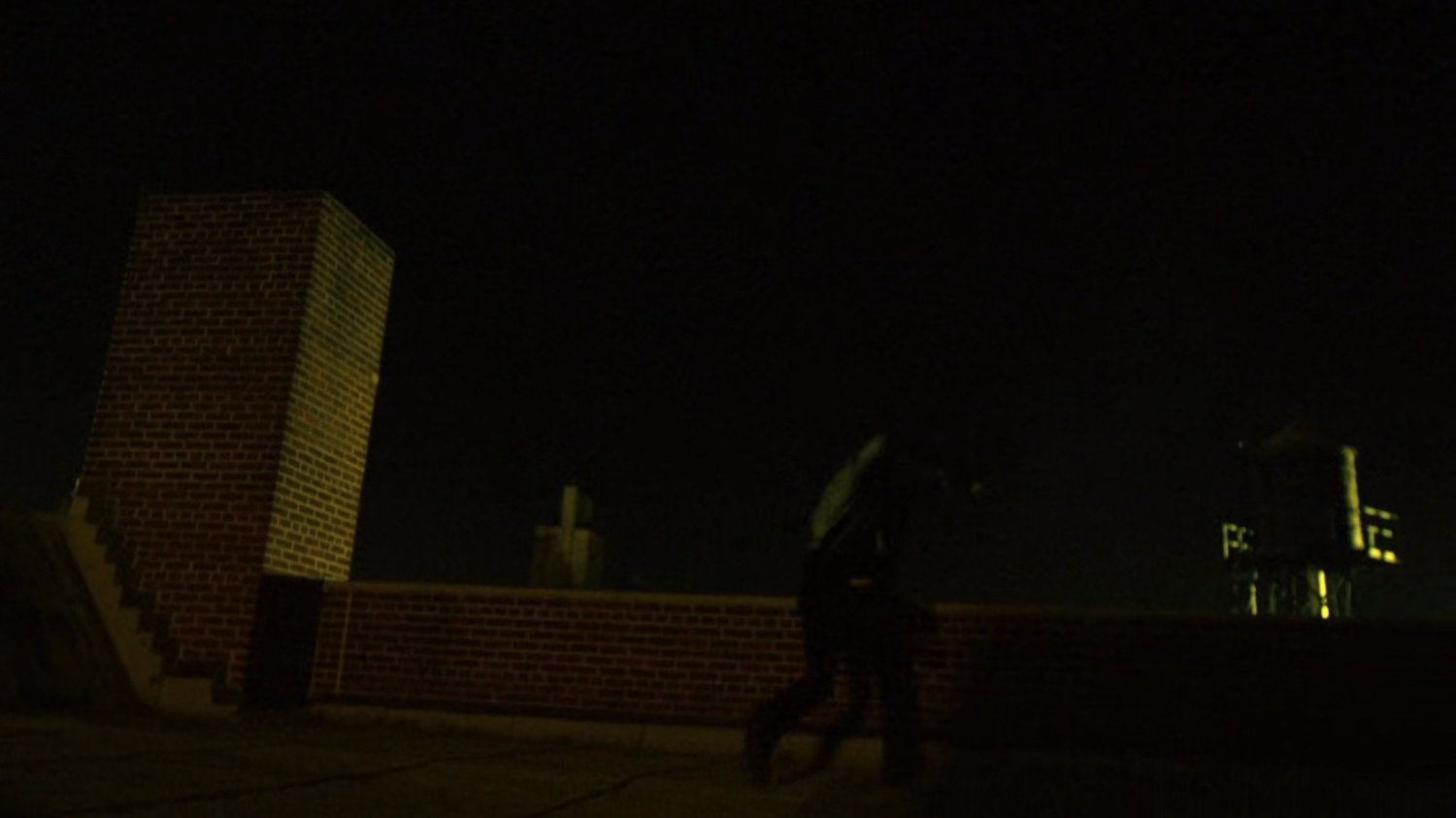 Turk running across a rooftop.