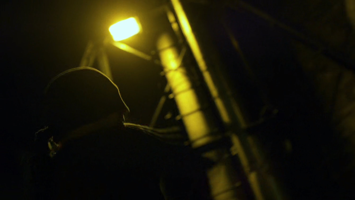 Daredevil on a dark rooftop.