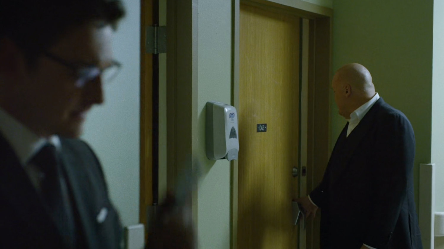 Fisk and Wesley in a Metro-General hospital hallway.