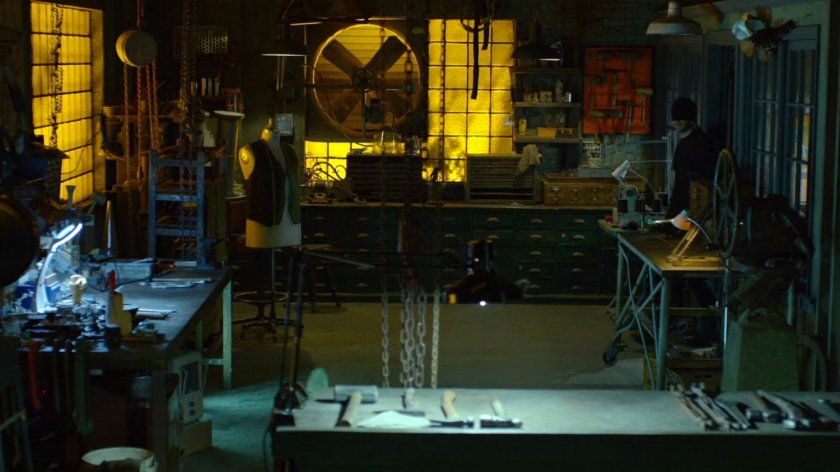 The Man in Black enters Melvin Potter's workshop.