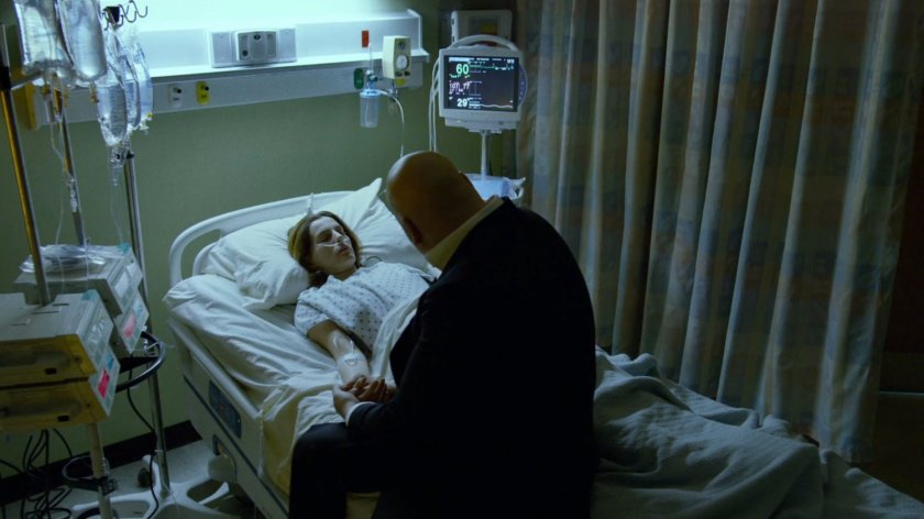 Fisk sitting with Vanessa in hospital room.