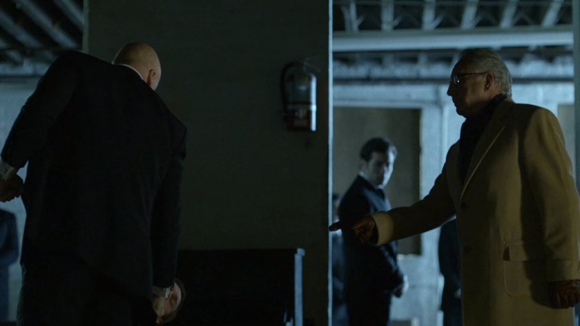 Leland in a dark basement.