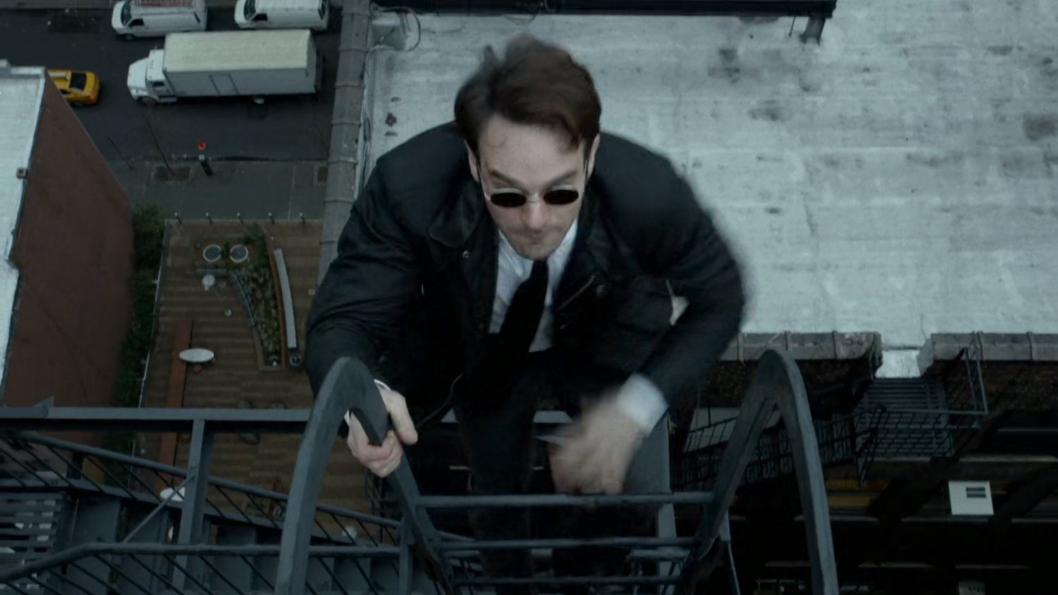 Matt climbs a ladder onto a New York rooftop.
