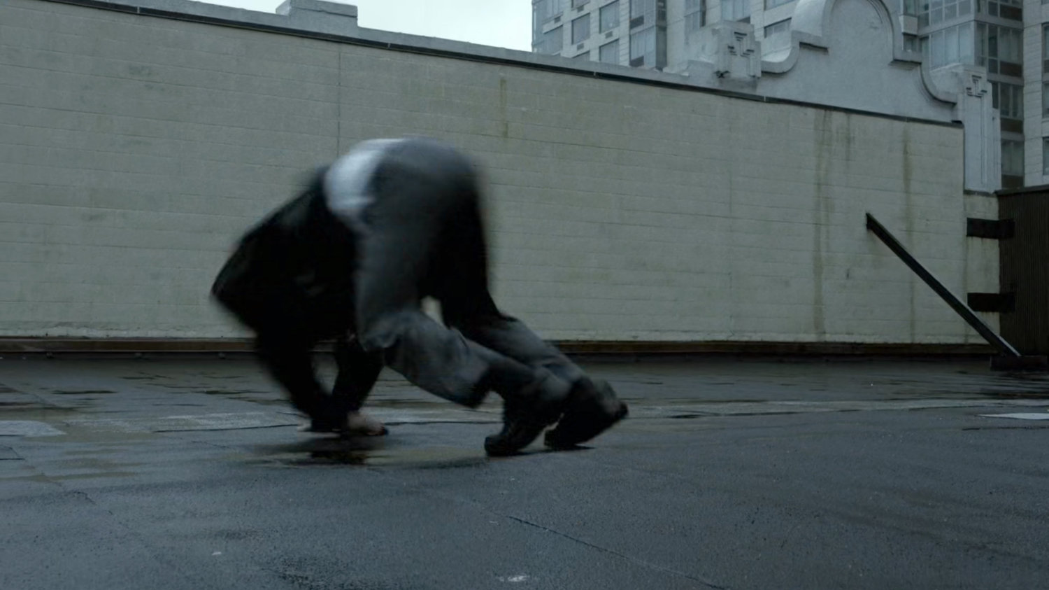 Matt tumbles across a New York rooftop.
