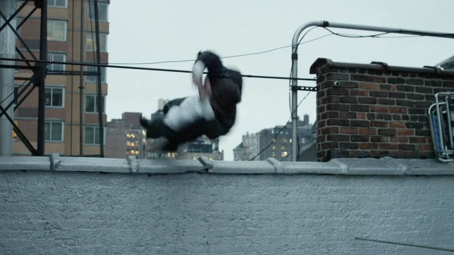 Matt dives onto New York rooftop.