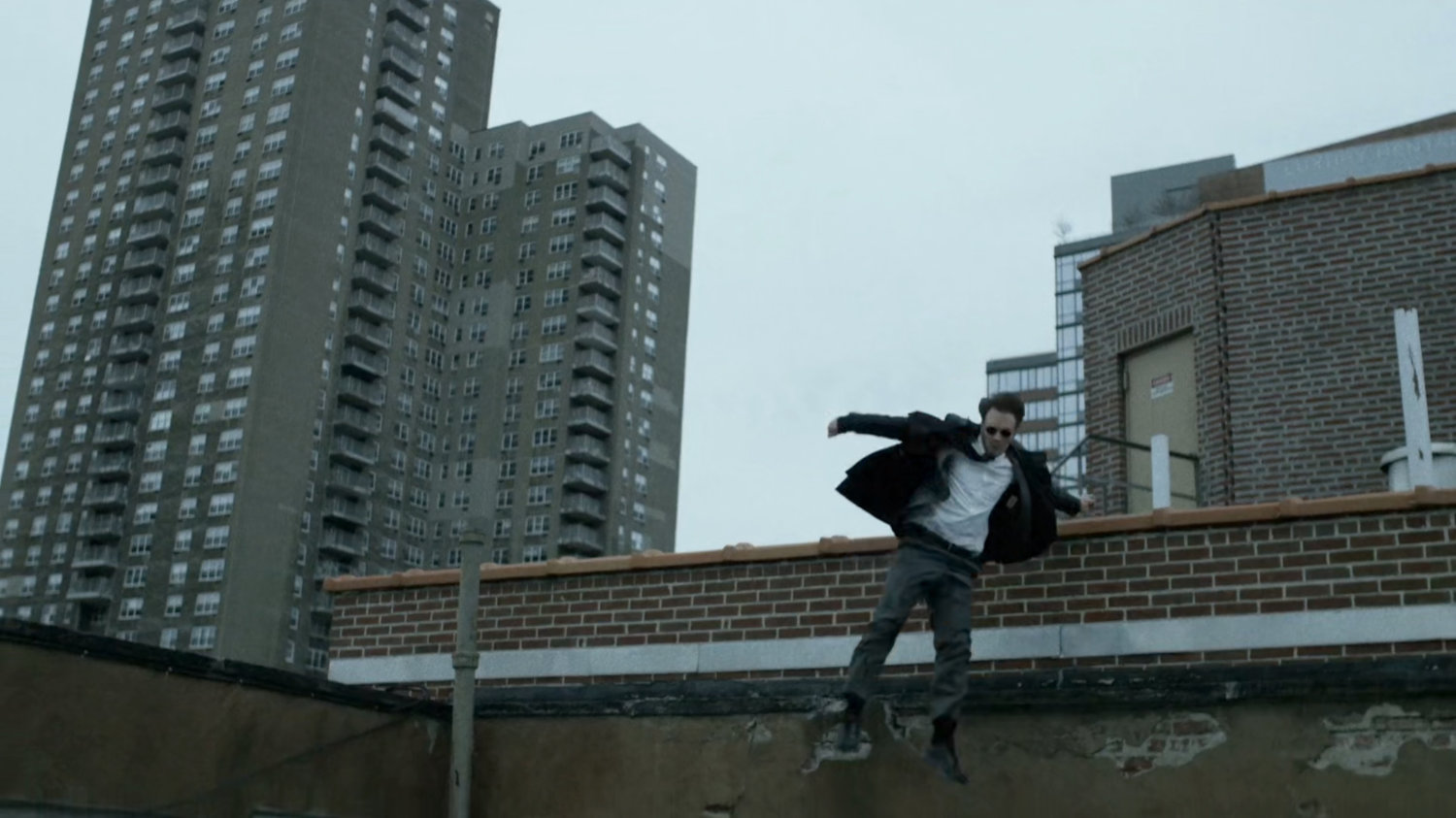 Matt runs across New York rooftop.