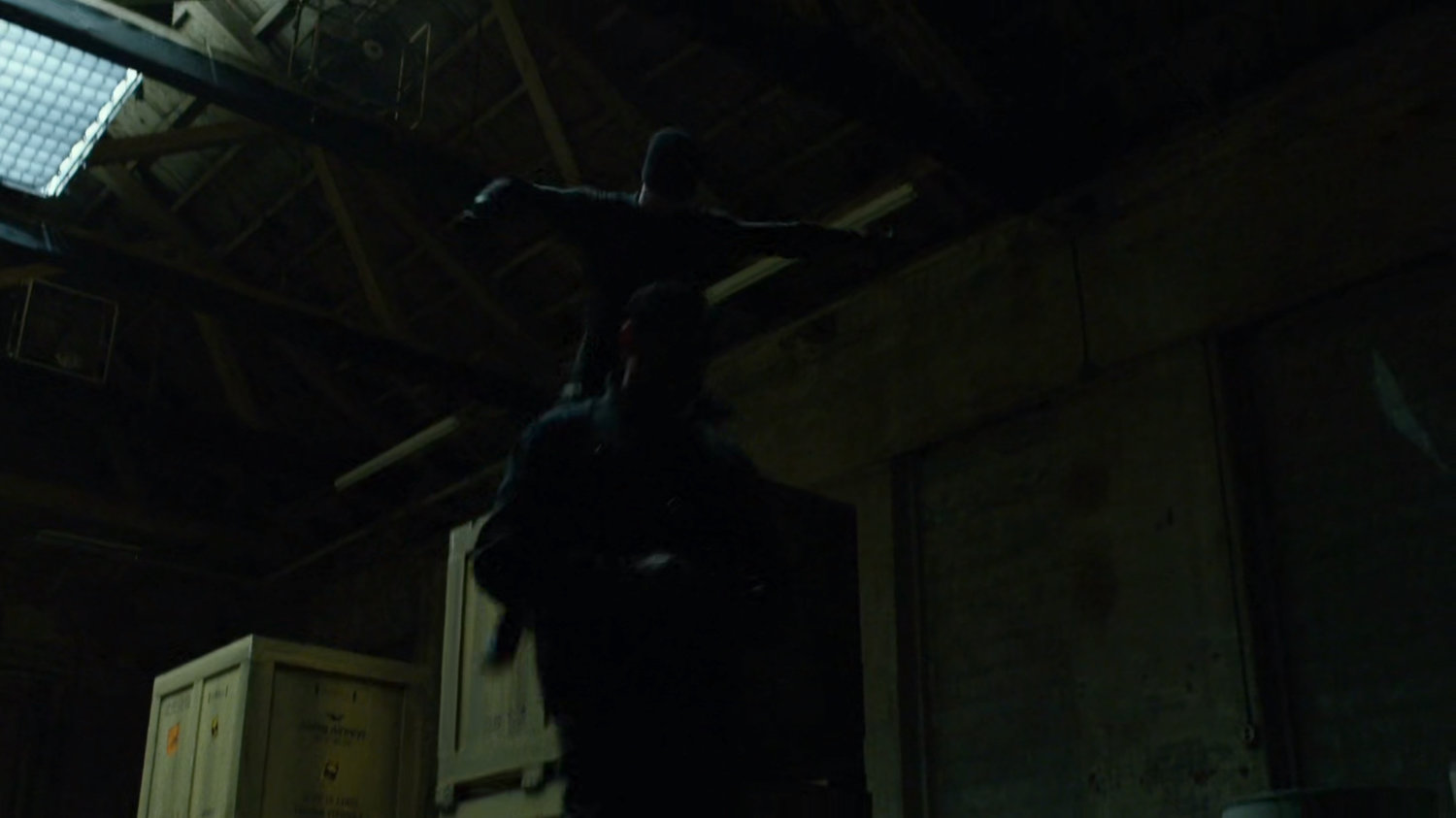 The man in black inside Gao's warehouse.