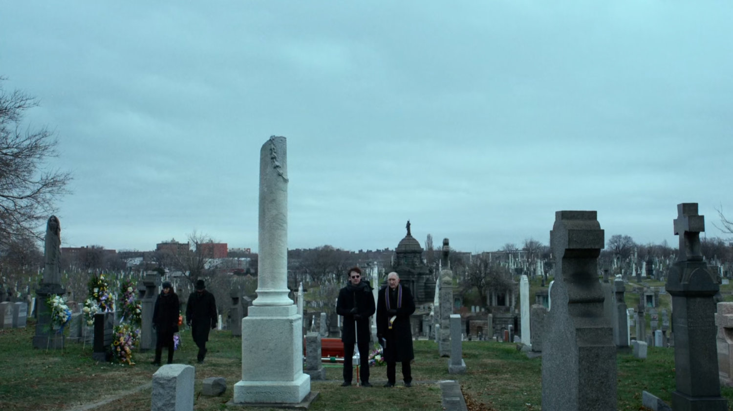Matt and Father Lantom at cemetery.
