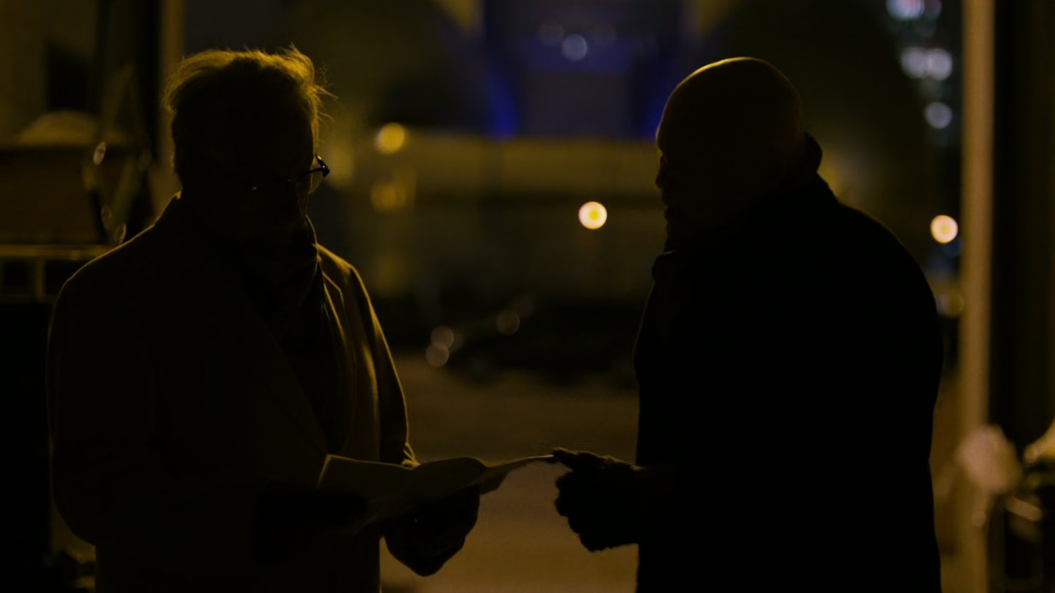 Leland and Fisk inside a dark garage.