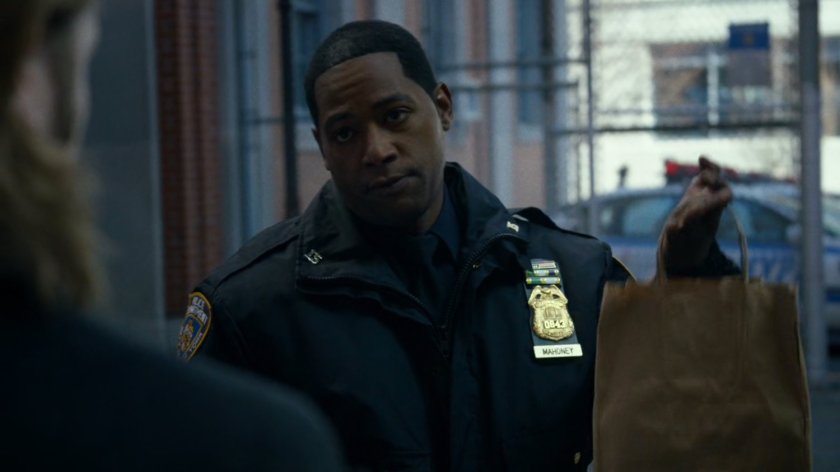 Brett in back of 15th precinct station.