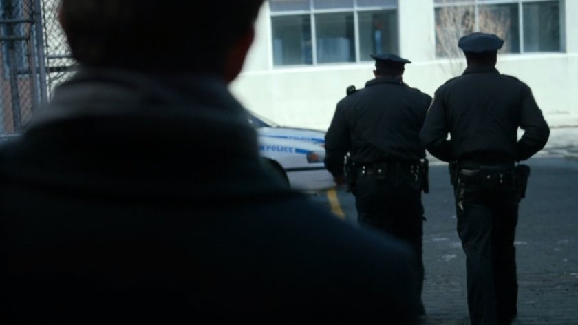 Matt listens to police officers behind 15th Precinct station.