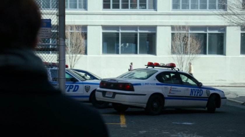 Police cars behind 15th Precinct station.