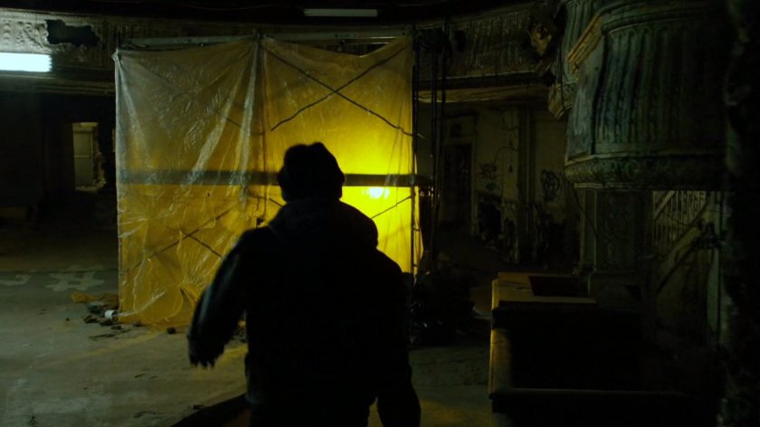 Man enters abandoned theater.