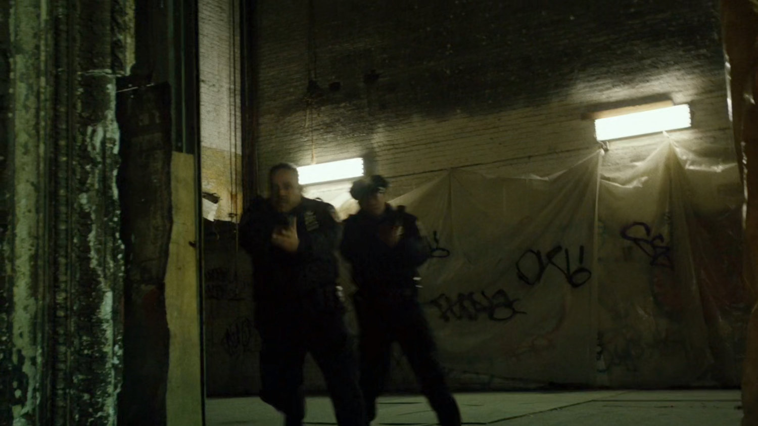 Police enter abandoned theater.