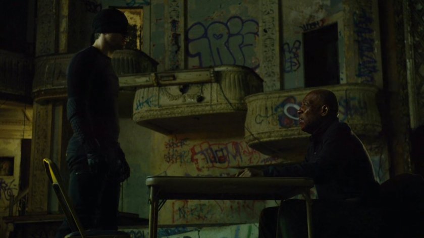 The Man in Black and Detective Hoffman inside abandoned theater.