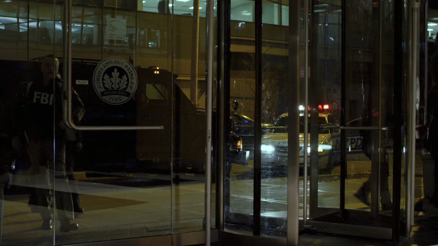 FBI agents approaching entrance of Fisk's building.
