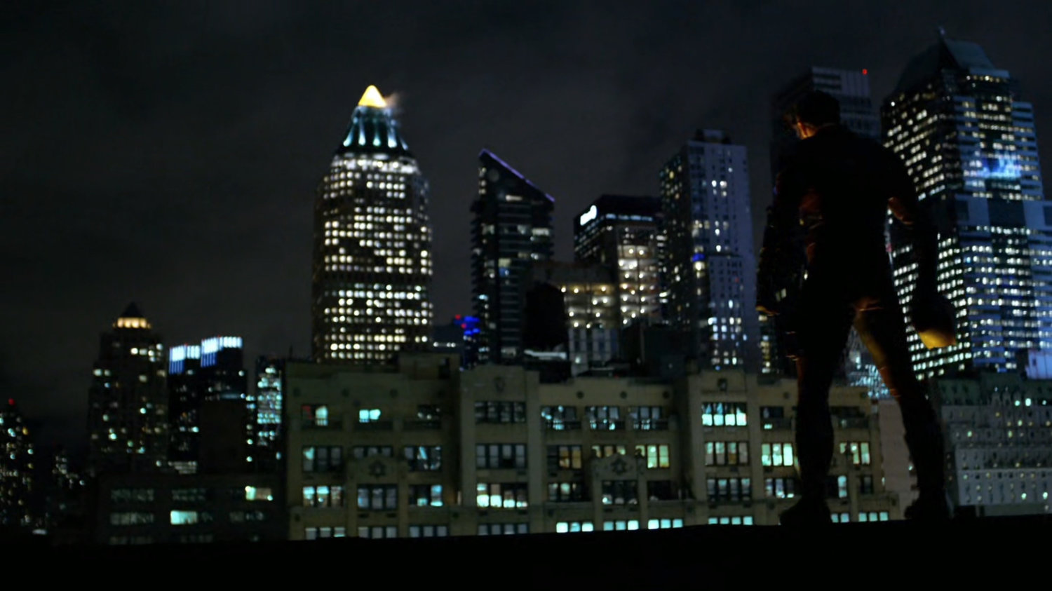 Matt in his new costume on a rooftop.