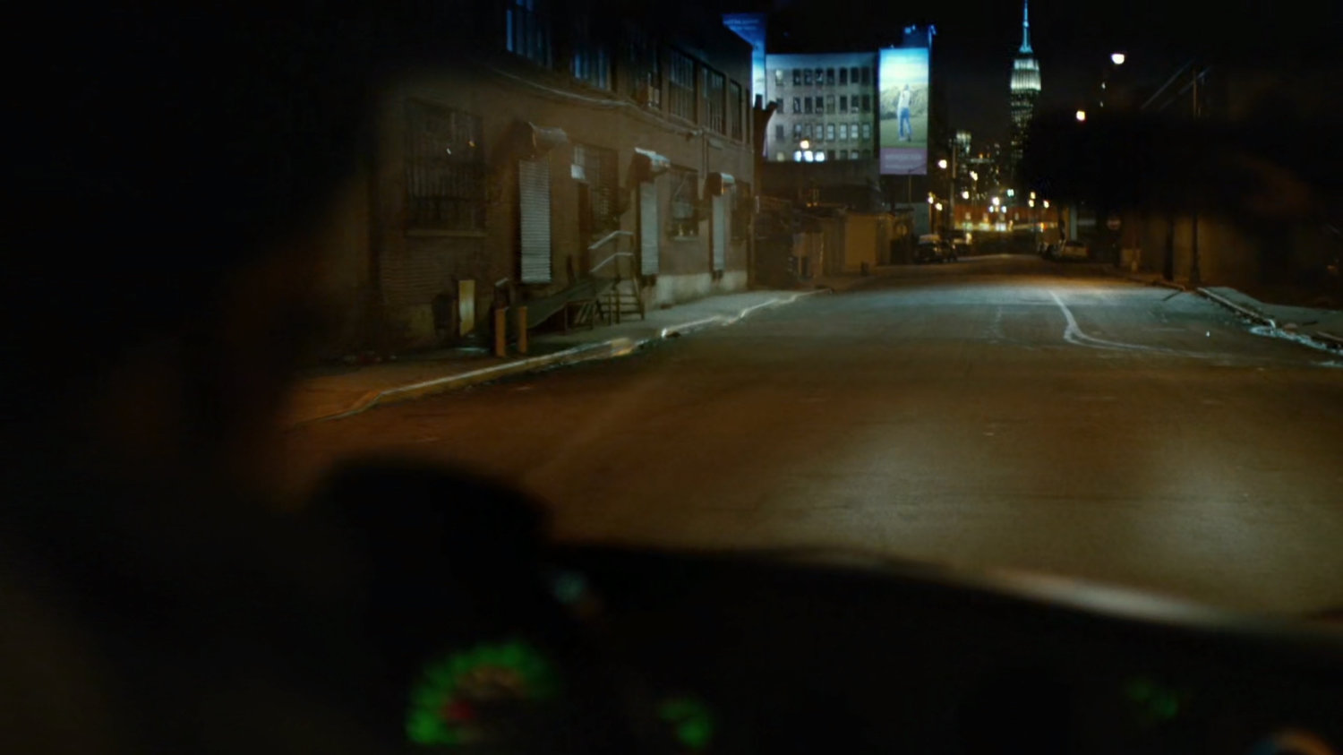 View from inside truck driving along city street.