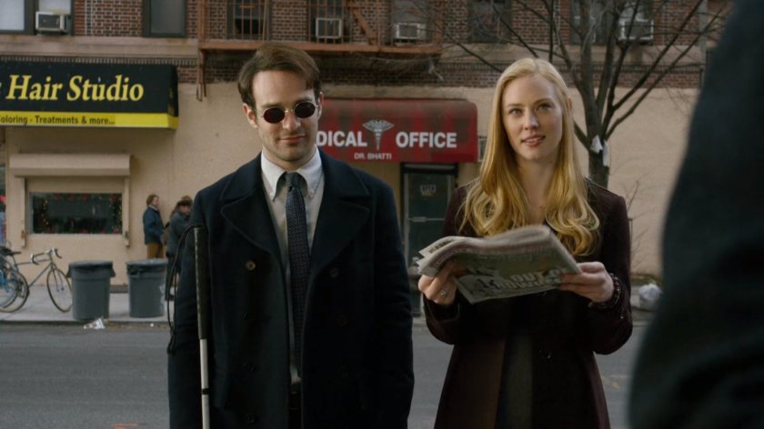 Matt and Karen on sidewalk outside Nelson and Murdock office building.