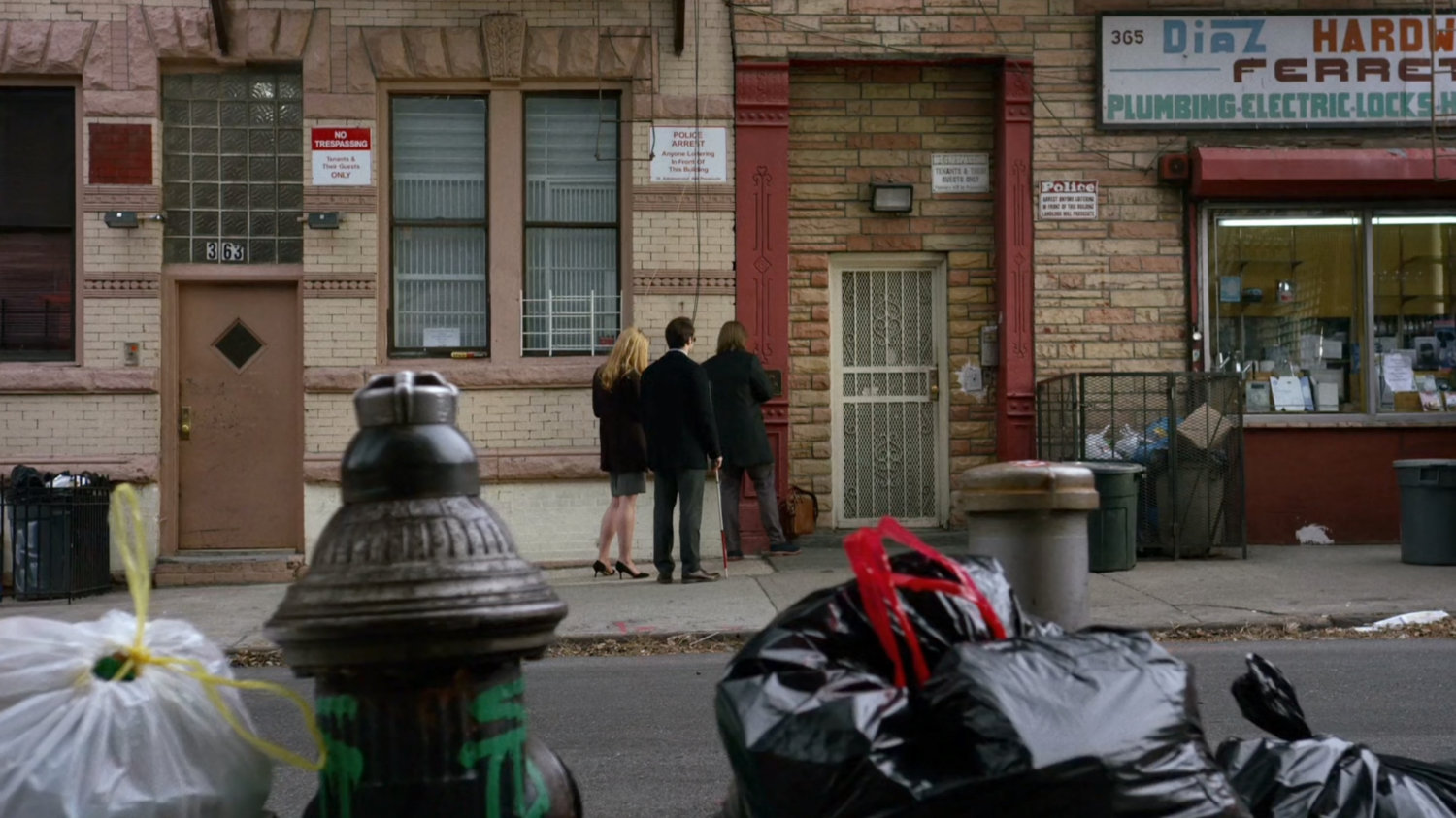 Matt, Karen, and Foggy on sidewalk outside Nelson and Murdock office building.