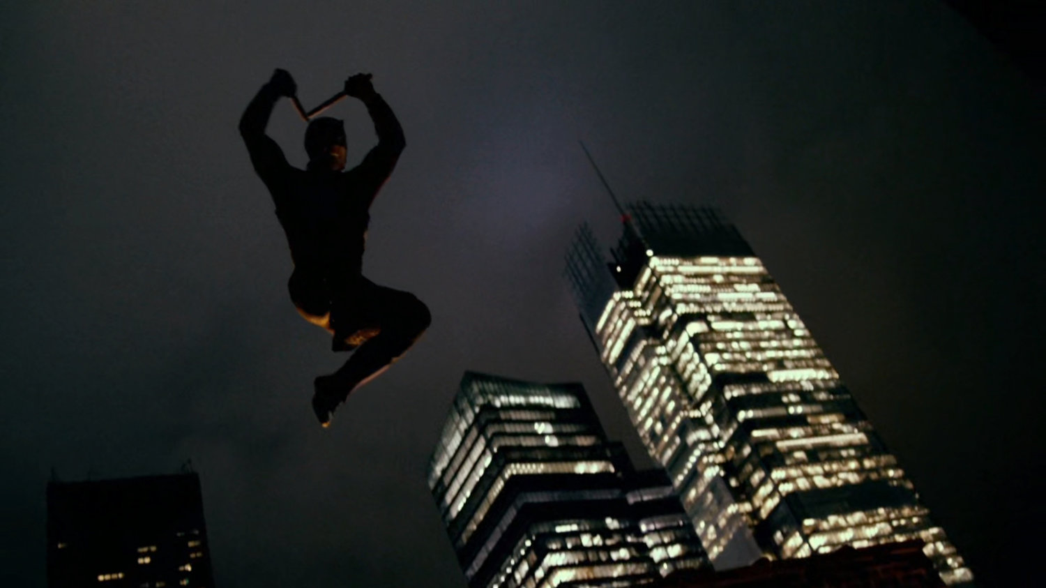 Daredevil leaping off a roof.