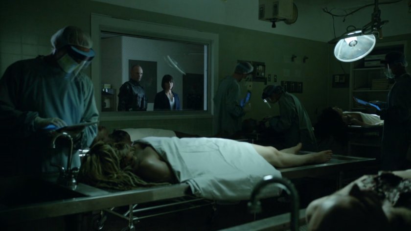 Rosalind Price and Banks look through window of ATCU medical facility.