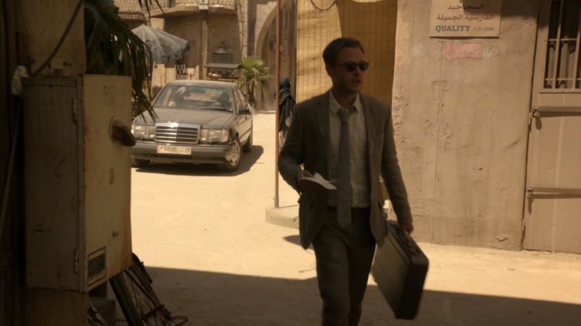 Fitz walks into dusty alley in Tangier.