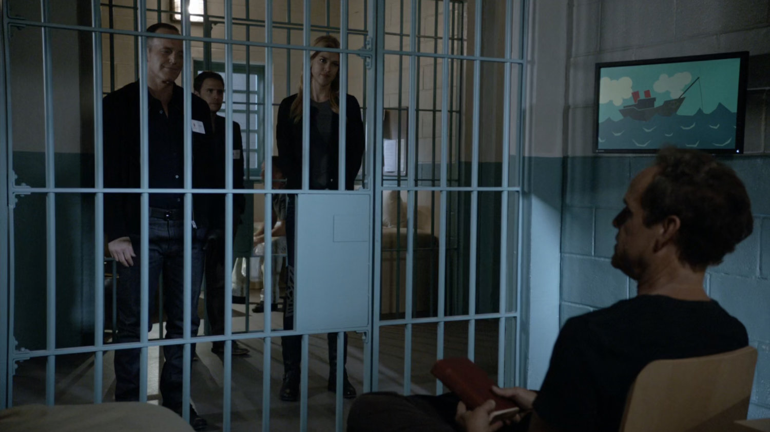 Coulson speaks to Professor Randolph in a Norwegian jail cell.