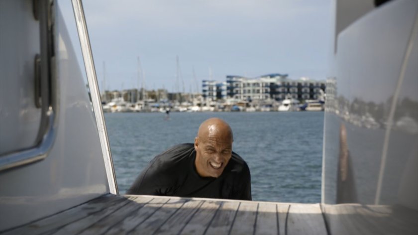 Kebo climbs aboard a yacht in Spanish marina.