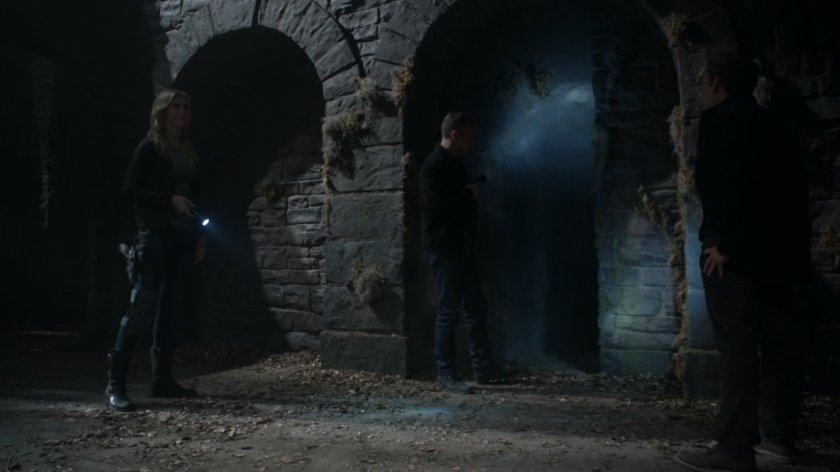 Bobbi and Coulson inside dark English castle.