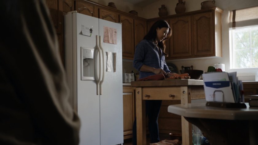May cutting vegetables in her father's kitchen.