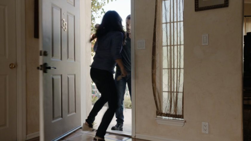 May attacks Hunter at the front door of her father's house.
