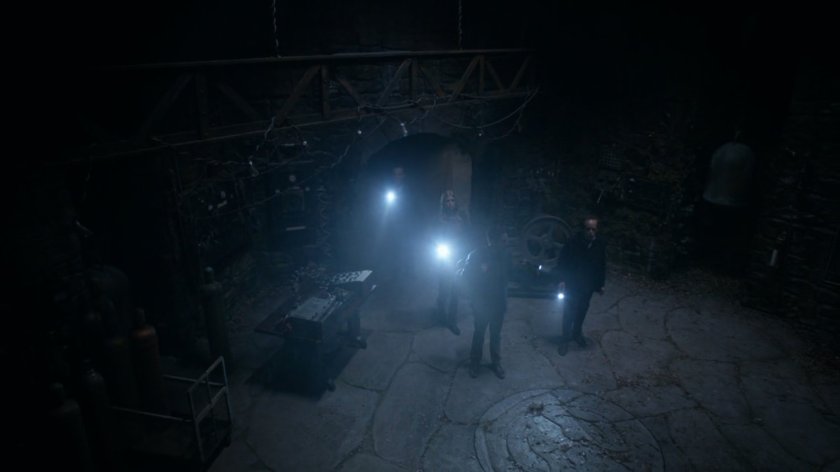 Coulson and team inside dark English castle.