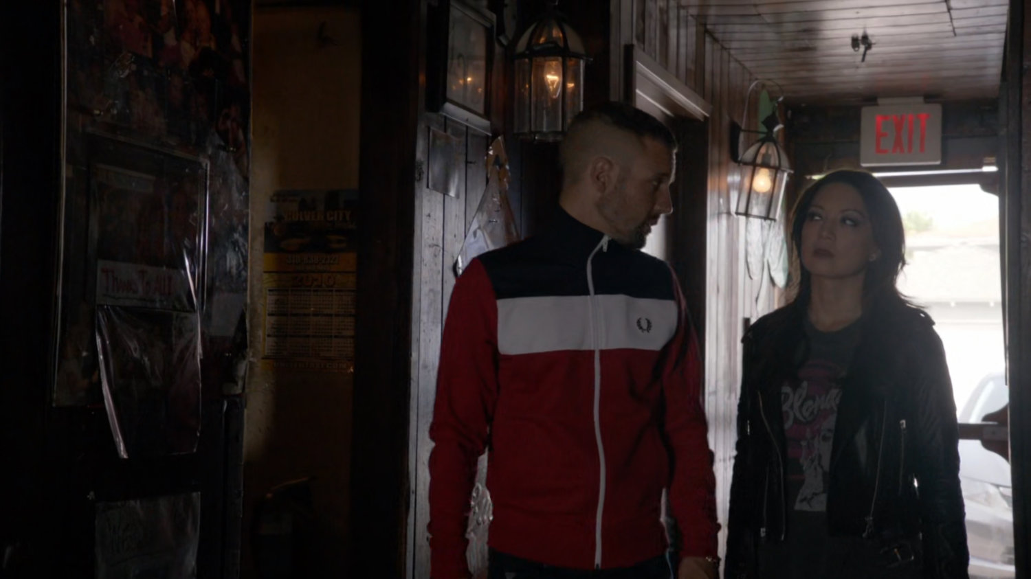May and Hunter enter Irish Bar from rear.