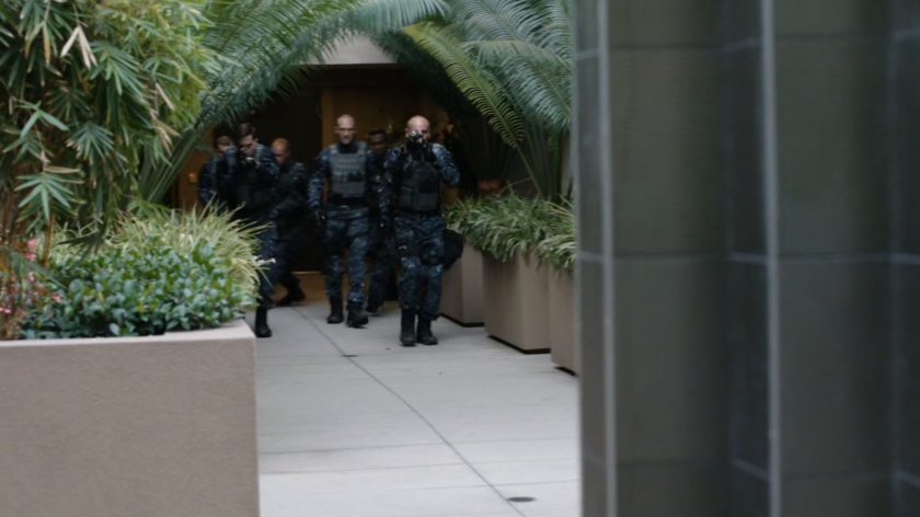 ATCU team entering apartment courtyard.