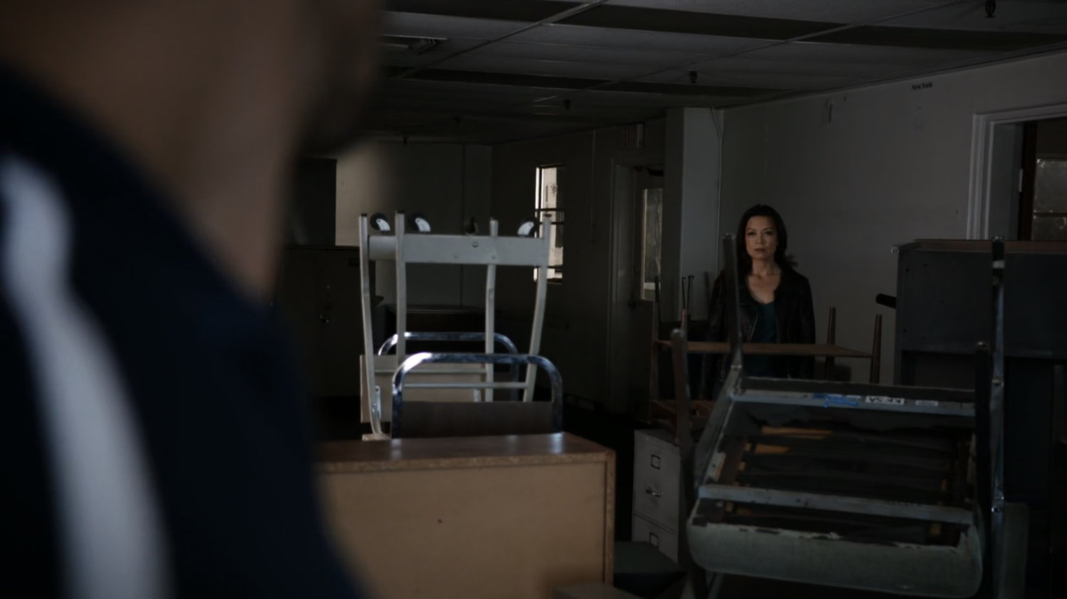 May looks ay Hunter in a HYDRA warehouse.