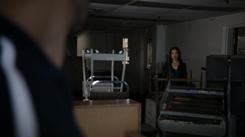 May looks ay Hunter in a HYDRA warehouse.