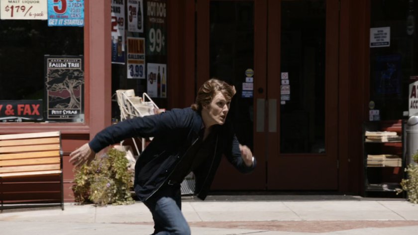 Werner von Braun runs in front of convenience store.