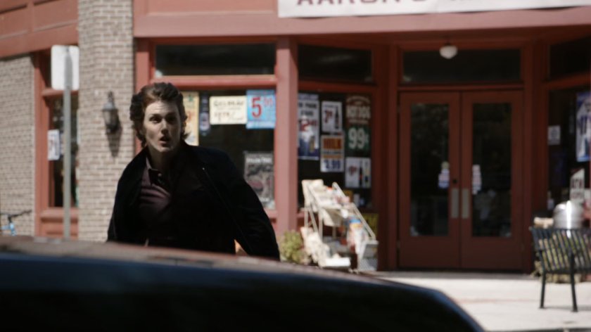 Werner von Braun runs in front of convenience store.