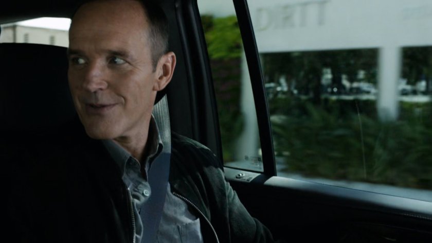 Coulson inside car on Washington DC street.