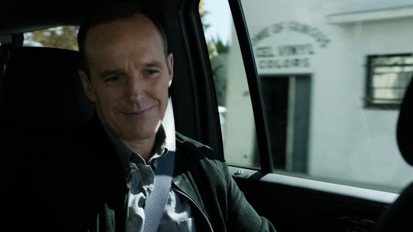 Coulson inside car on Washington DC street.