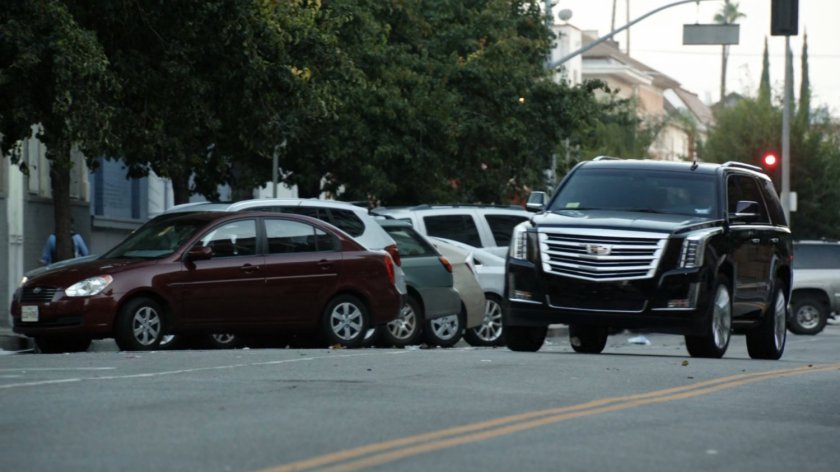 SUV drives along Washington DC street.