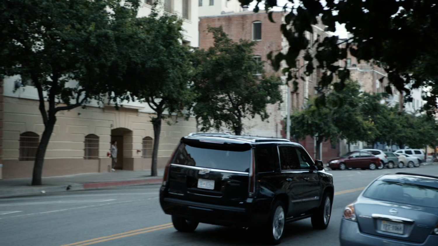 SUV drives along Washington DC street.