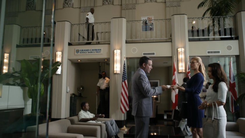 May and Bobbi meet with bank manages inside of Grand Cayman Royale Bank and Trust.