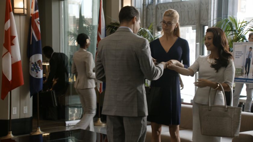 May and Bobbi meet with bank manages inside of Grand Cayman Royale Bank and Trust.