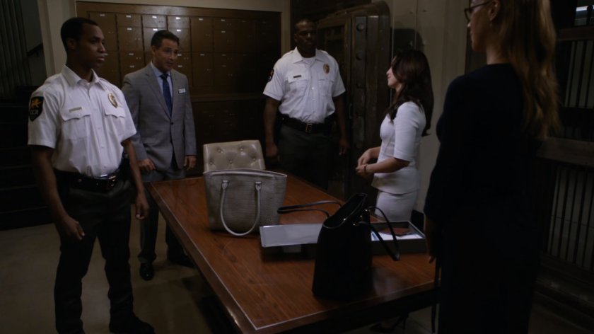 Bank manager, guards, May and Bobbi inside vault of Grand Cayman Royale Bank and Trust.