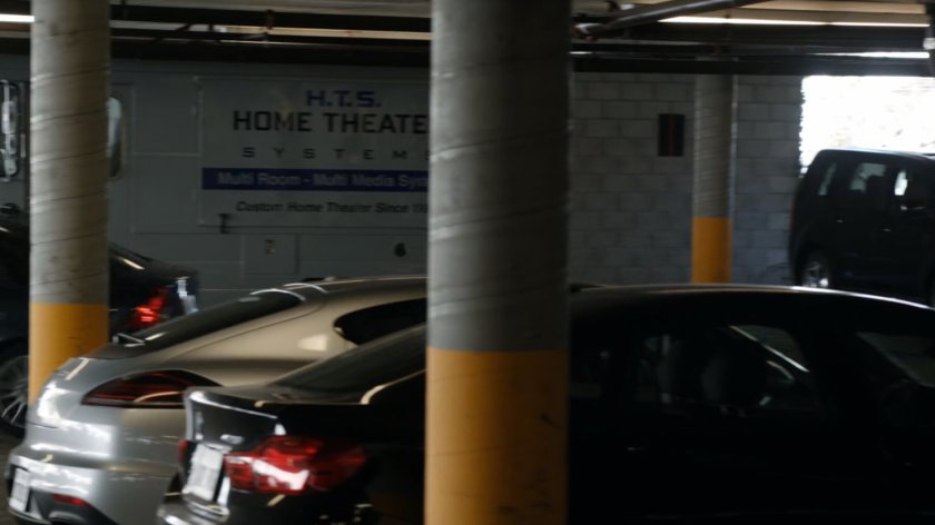 A Home Theater van in a parking garage.
