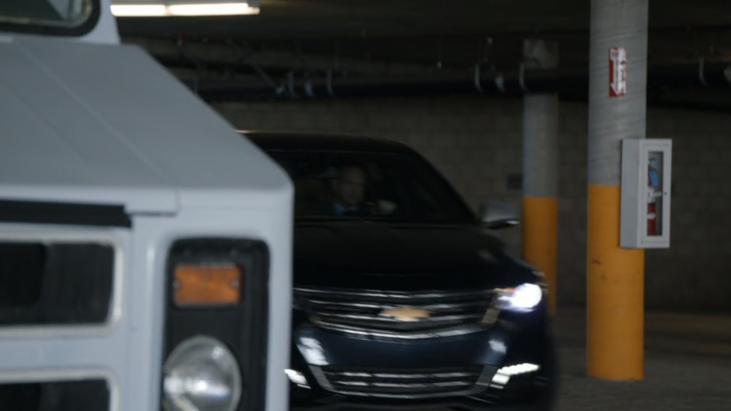 Banks driving out of parking garage.
