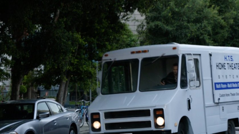 Home theater truck driving along Washington DC street.