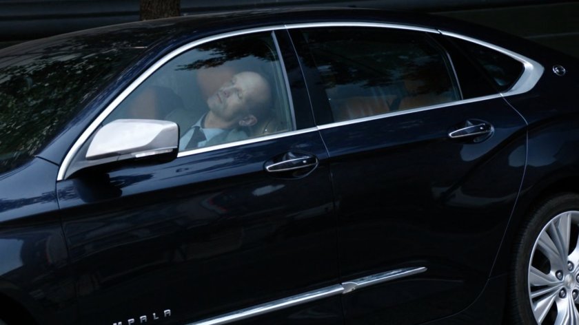 Banks unconscious in his car.